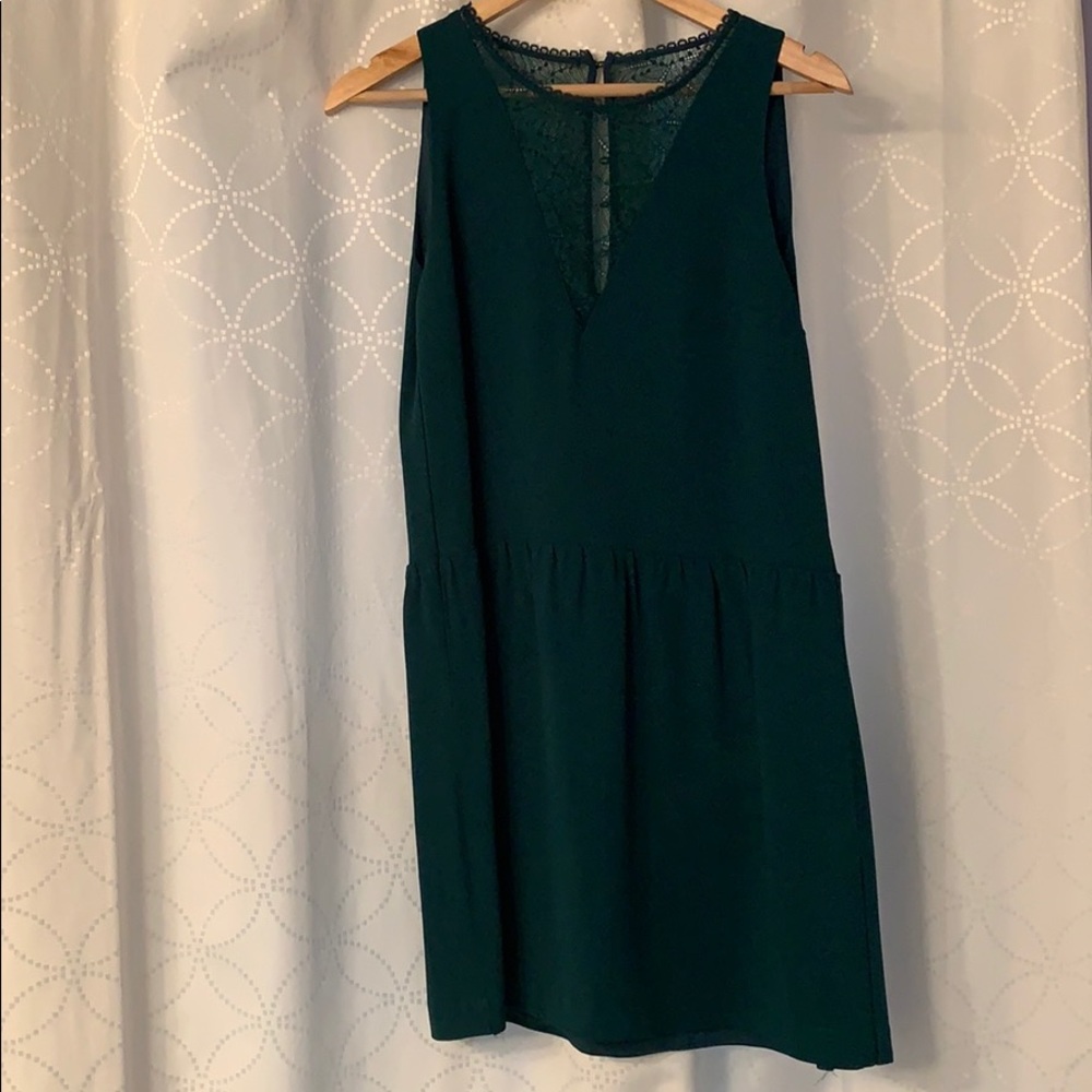 Green baby doll dress with hand stitching